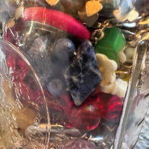 Jar filled with mystery costume jewelry.
